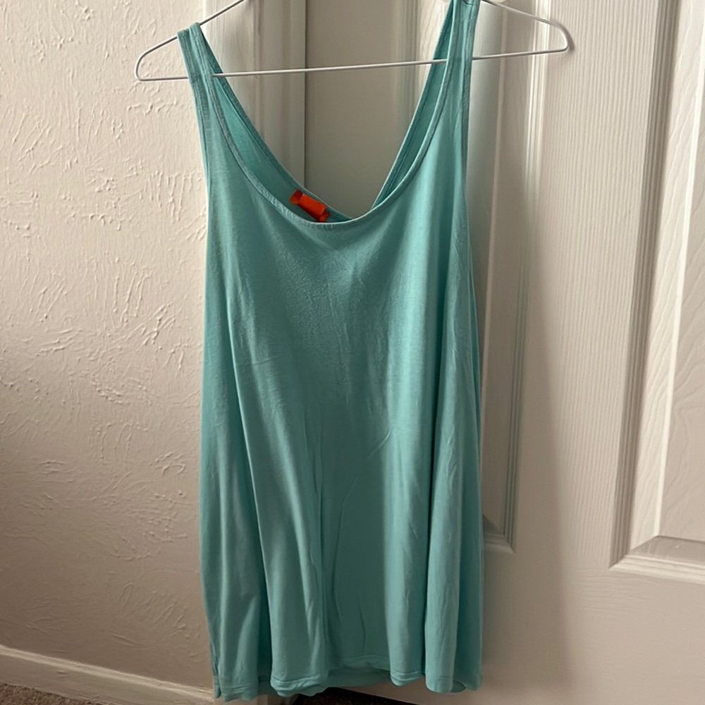 Slightly worn light blue tank top with unique “open” back
